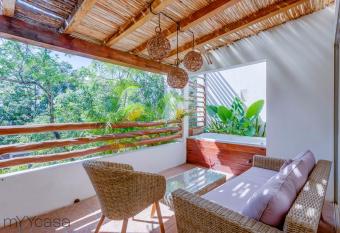 Beautiful Villa with Private Jacuzzi in Aldea Zama has rooms with a private hot tub