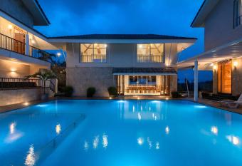 The Ourea by StayVista with Splendid landscapes, Sprawling lawn, Swimming pool, TT table & Modern decor allows 18 year olds to book a room