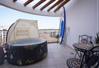 two bed room apartment 5 min walk to the beach has Balcony rooms