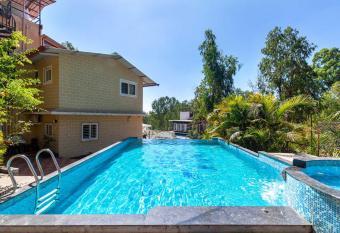 StayVista s Chimney Cottage with Sprawling Lawns, Picturesque Views, Plunge Pool, Jacuzzi, and Home Theatre allows 18 year olds to book a room