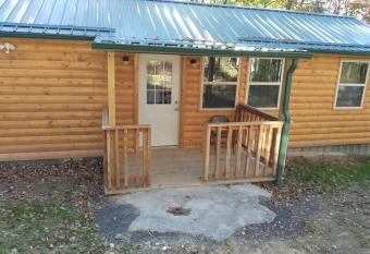 Cabin with a tree house on a buffalo farm . has Balcony rooms