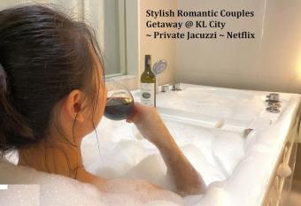 Stylish Romantic Couples Getaway at KL City 1419 has rooms with a private hot tub