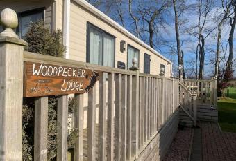 Woodpecker lodge, Camelot Holiday Park, CA6 5SZ allows 18 year olds to book a room