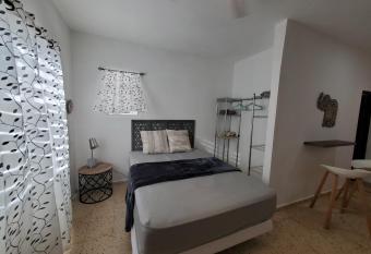 Aguadilla Surfers Lair apt with electricity water AC Wifi 8 minute walk to Crashboat beach has Balcony rooms