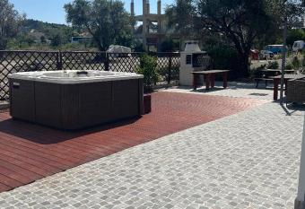 RHODIAN TREASURE Spiridione apartment has rooms with a private hot tub