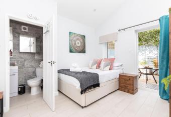 Stylish studio flat with private patio and free on-street parking allows 18 year olds to book a room