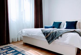 By The River Apartment has rooms with a private hot tub