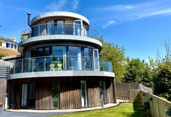 One of the best properties in Lyme! Breathtaking views across the whole bay. 3 stories with 2 tier veranda around the property. Sleeps 6 has Balcony rooms
