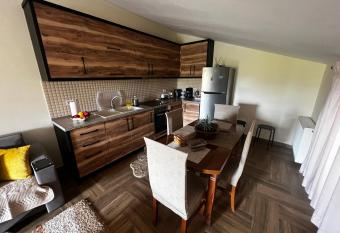 Lovely and cozy 1-bedroom house with a sunny patio has Balcony rooms