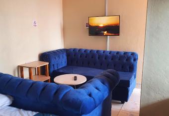 Lola s Nest along the Highway - Free Parking, Wifi, Netflix & Rooftop views allows 18 year olds to book a room