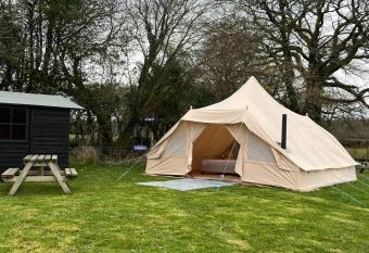 Hassle free rent a Toureg Glamping tent on a family campsite with log burner and double bed, 2 chair beds and friendly animals for up to 6, Just bring your own bedding allows 18 year olds to book a room