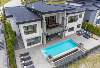 Newly Modern House w/ urban landscape of Kelowna!    has rooms with a private hot tub