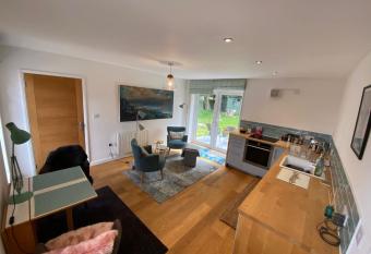 Self-contained, ground floor apartment with parking and patio allows 18 year olds to book a room