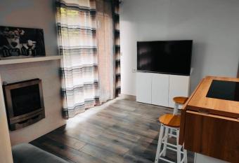 Cozy one-bedroom flat with indoor fireplace has Balcony rooms