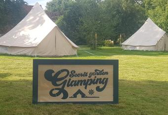 Secret garden glamping African themed tent has rooms with a private hot tub