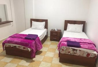 Elite Furnished Apartment has rooms with a private hot tub