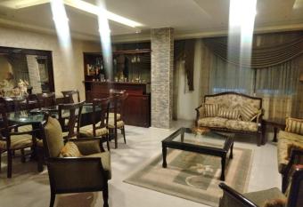 City Center Furnished Apartment has rooms with a private hot tub