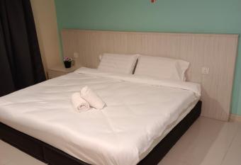 Glossy Homestay Marina Island has rooms with a private hot tub