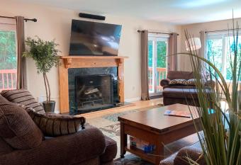 Multi-level Stratton Mountain Home has rooms with a private hot tub