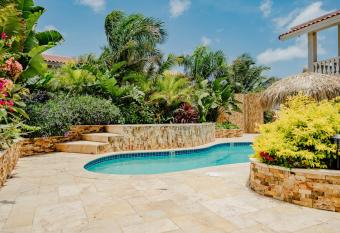 Gorgeous modern 2-bedroom apartment with tropical garden, pool and jacuzzi has Balcony rooms