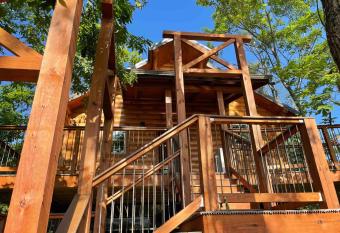 Cricket Hill Treehouse by Amish Country Lodging has Balcony rooms