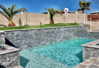 Paradise Oasis! Waterfall pool & spa has rooms with a private hot tub