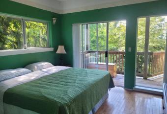 rainforest suite with a king size bed has Balcony rooms