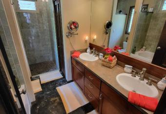 Unique Lava House by steaming crater has rooms with a private hot tub