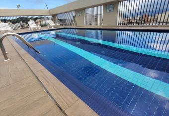 Flat Completo Novo a 400m da praia com piscina has Balcony rooms