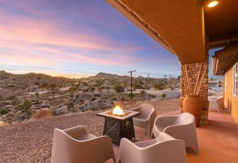 Relo Ranch by Hi Desert Dwellings a Mountain Top Property with Hot Tub Fire Pit Ping Pong and Amazing Sunsets allows 18 year olds to book a room