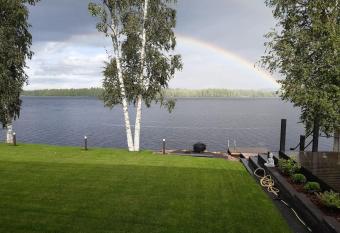 Villa by the river with beach sauna and jacuzzi has rooms with a private hot tub