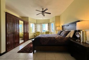 A Luxurious 4-Bedroom Private Villa with Games Room, Theatre & Modern Art has rooms with a private hot tub