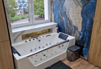 PocztowaResort has rooms with a private hot tub