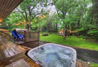 Hot Tub Playhouse Game Room BBQ Firepit Self check In has rooms with a private hot tub