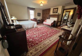 Upstairs Historic 1 Bedroom 1 Bath Suite with Mini-Kitchen, Porch & River Views allows 18 year olds to book a room