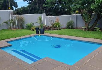 Double story home with pool - stones throw from the beach!! has Balcony rooms