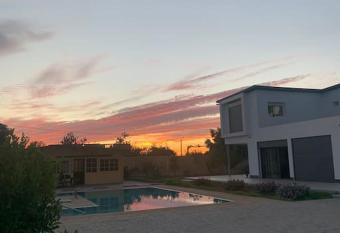 Magnifique villa avec piscine has Balcony rooms