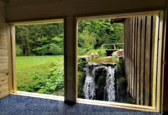 Wooden house with a waterfall  has Balcony rooms