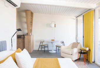 The Bungalows by Homestead Modern ADA Studio allows 18 year olds to book a room