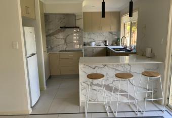 Shared house with other guests near shopping center and theme parks allows 18 year olds to book a room