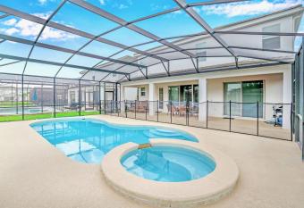 10BR Family Home Near Disney w Pool & BBQ has Balcony rooms