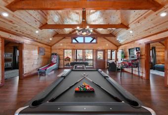 8 bed cabin with pool, outdoor fireplace and gazebo allows 18 year olds to book a room