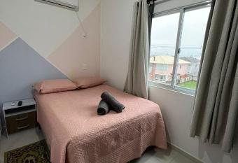 Apartamento completo com garagem e churrasqueira. has Balcony rooms