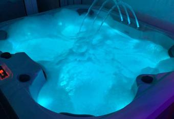 Get Away Home With Hot Tub Sleeps 4 has rooms with a private hot tub