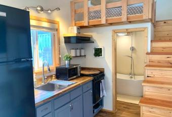 Charming Sunshine Tiny Home has Balcony rooms