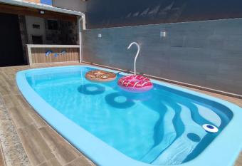 Casa de Praia com Piscina por Temporada Orla 500 Unamar Cabo Frio RJ allows 18 year olds to book a room