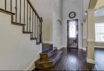 Beautiful home with green belt has rooms with a private hot tub