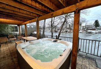 Cozy Cabin on the Lake w/ HotTub has rooms with a private hot tub