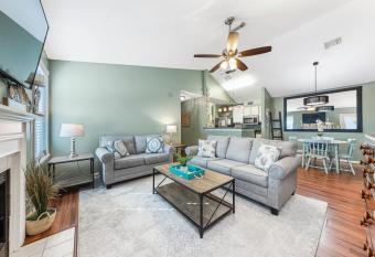 Cozy budget friendly condo close to the beach has rooms with a private hot tub