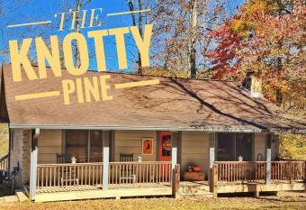 The Knotty Pine - Riverfront 3 Bedroom 2 Bath Cabin with Fireplace has rooms with a private hot tub